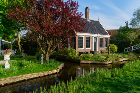 rural dutch country scenery of houses in small old town Zaanse Schans, Netherlandsの写真素材