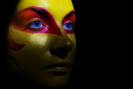  Portrait of a mysterious woman with artistic make-up on her face. Isolated on black backgroundの写真素材