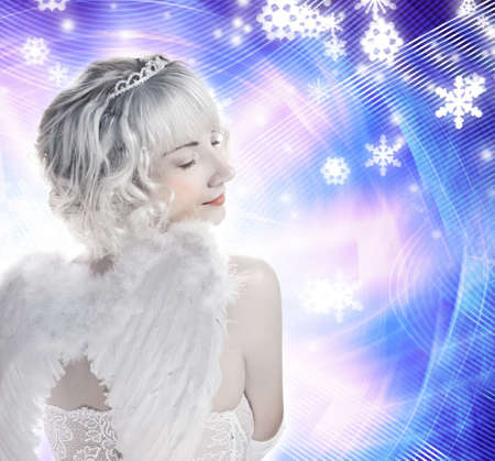 Beautiful Angel girl on abstract winter backgroundの写真素材