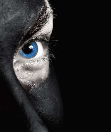 Portrait of a mysterious woman with artistic make-up on her face. の写真素材