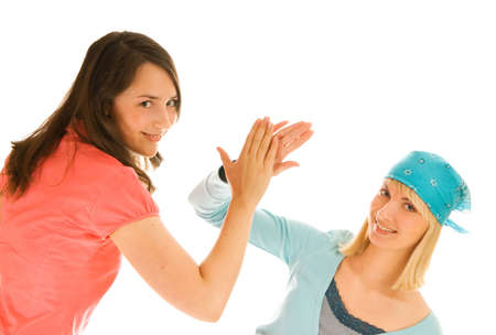 Two teenagers giving high five isolated on white background