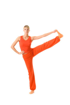 Beautiful young woman doing yoga exercise isolated on white backgroundの写真素材