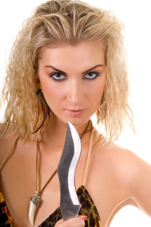 Beautiful wild woman with a knife isolated on white backgroundの写真素材