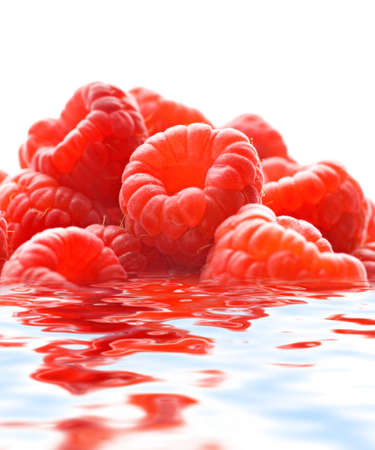 Raspberries reflected in waterの写真素材