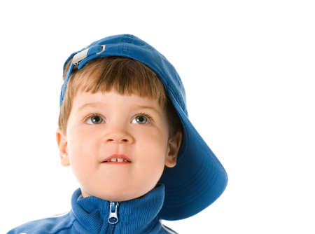Handsome little boy looking at something. Isolated on white backgroundの写真素材