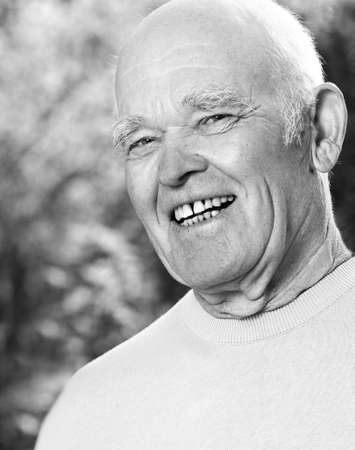 Monochrome potrait of happy elderly man