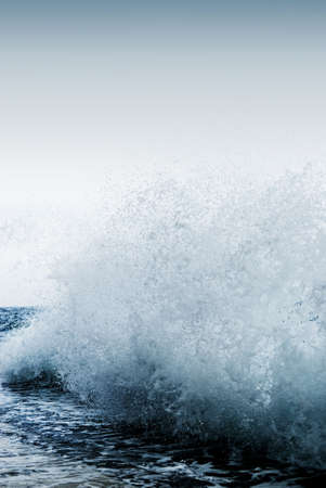 Big ocean wave breaking the shoreの写真素材