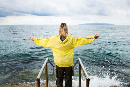 Woman spreading her armsの写真素材