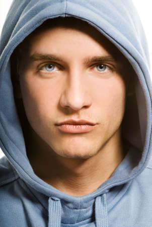 Handsome young man in a hoodの写真素材