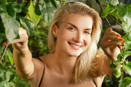 Beautiful young woman in a forestの写真素材