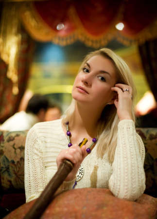 Beautiful young woman with hookahの写真素材