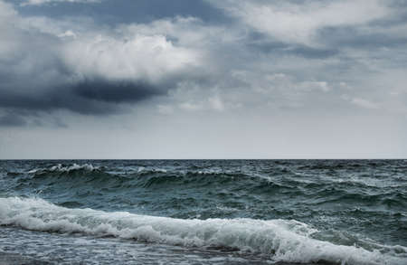 Big ocean wave breaking the shore
