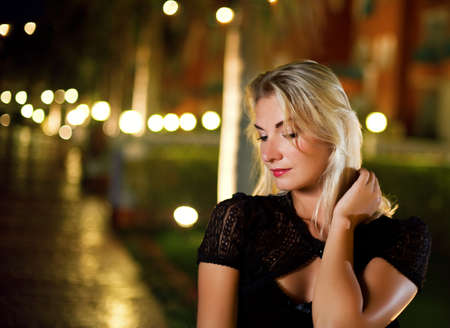 Beautiful young woman relaxing outdoorsの写真素材