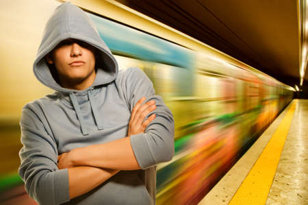 Young criminal in subwayの写真素材