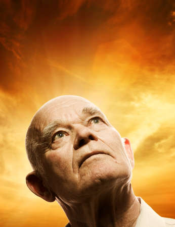 Portrait of an elderly man looking up