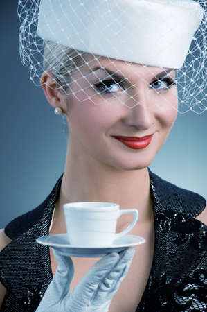 Lovely lady with coffee cupの写真素材