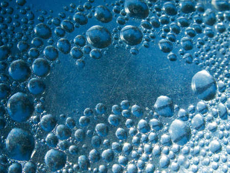 Abstract background. Liquid on dirty glassの写真素材