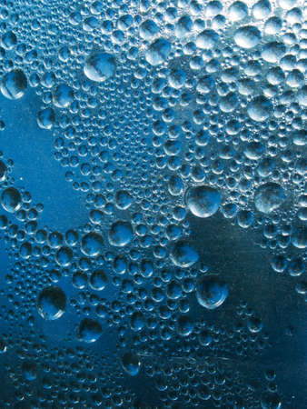 Abstract background. Liquid on dirty glassの写真素材