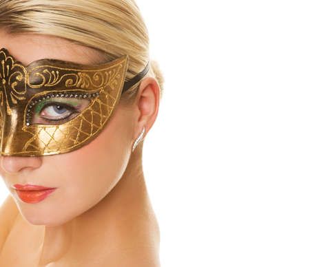 Beautiful young woman in carnival maskの写真素材