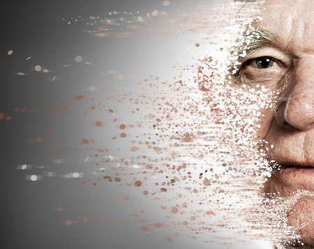 Elderly man's face falling apart. Aging conceptの写真素材