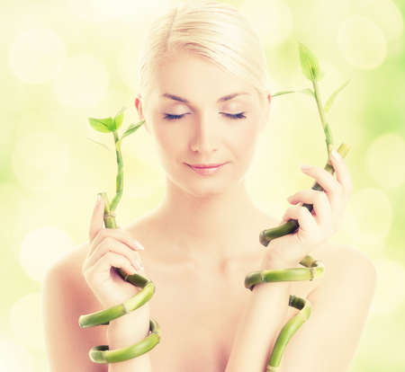Beautiful woman with bamboo plant

の写真素材