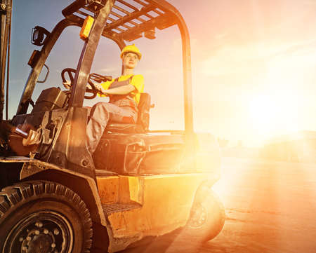 Female worker driving cargo truck