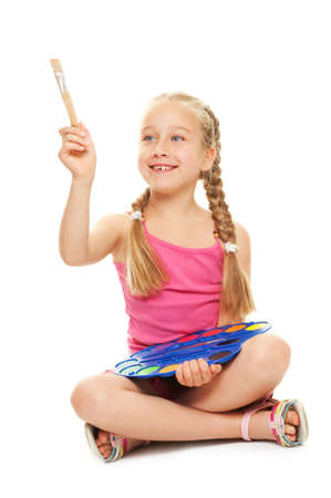 Beautiful little girl with a paintbrush, Isolated on white

の写真素材