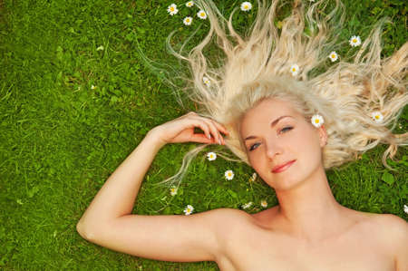 Young woman relaxing on a meadow

の写真素材