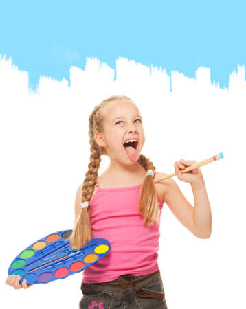 Beautiful little girl painting with blue paint

の写真素材