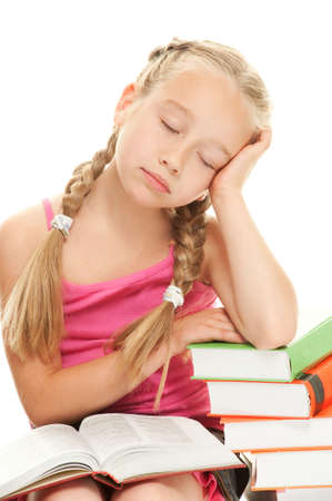 Little schoolgirl fall asleep after reading a book

の写真素材