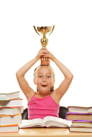 Happy schoolgirl with a golden cup
の写真素材