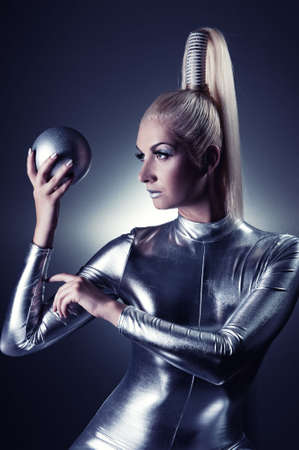 Beautiful cyber woman with silver ballの写真素材