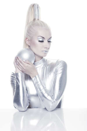 Beautiful cyber woman with silver ballの写真素材