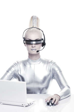Beautiful cyber woman working on her laprop 

