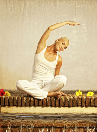 Beautiful young woman doing yoga exerciseの写真素材