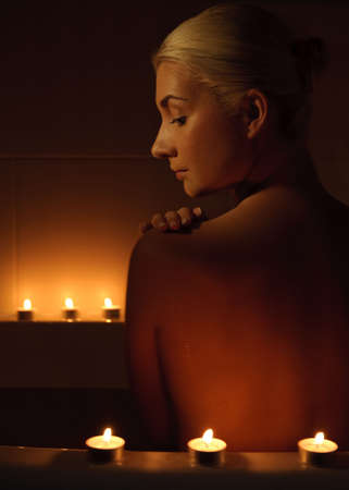 Lovely young woman relaxing in bathroom 
の写真素材