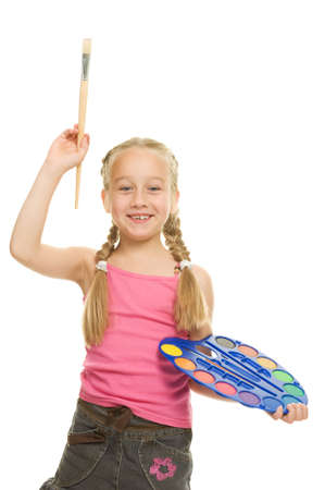 Beautiful little girl with a paintbrush, Isolated on white 

の写真素材