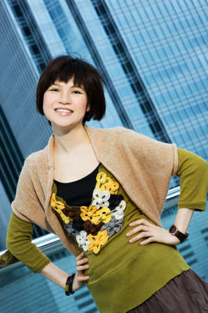 Beautiful chinese woman having fun outdoorsの写真素材