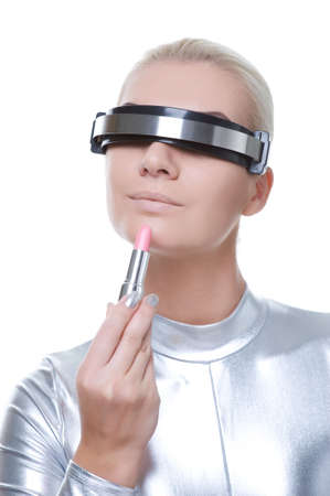 Beautiful cyber woman applying make-up 

の写真素材