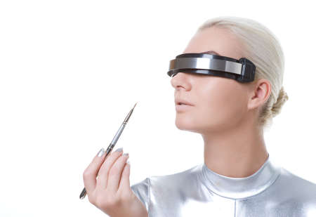 beautiful cyber woman applying lipstick using lip concealer brush 


の写真素材
