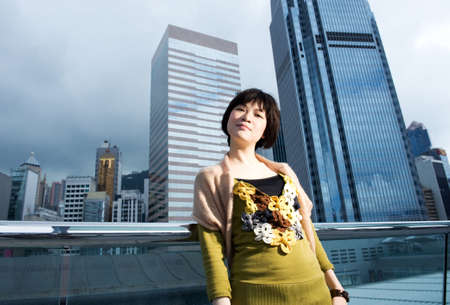 Beautiful chinese woman having fun outdoors の写真素材