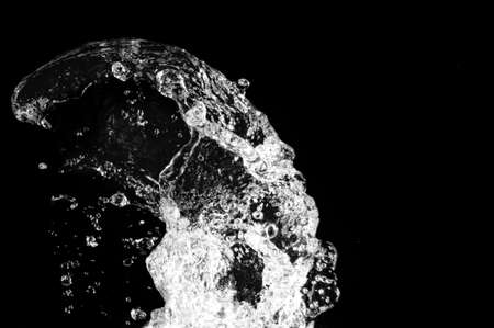 Stylish water splash. Isolated on black background の写真素材