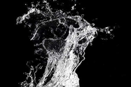 Stylish water splash. Isolated on black background の写真素材