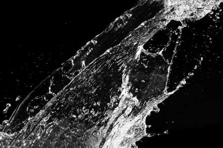 Stylish water splash. Isolated on black background の写真素材