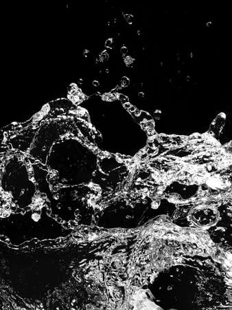 Stylish water splash. Isolated on black background 
の写真素材