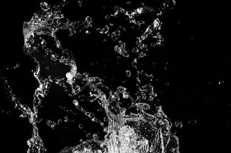 Stylish water splash. Isolated on black background 
の写真素材