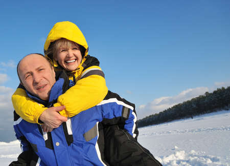 Middle aged couple having fun on a winter dayの写真素材