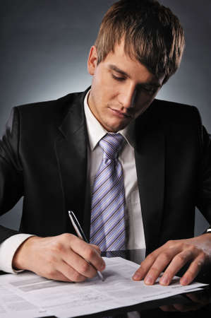 Businessman signing a contractの写真素材