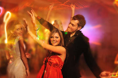 People dancing in the night club の写真素材