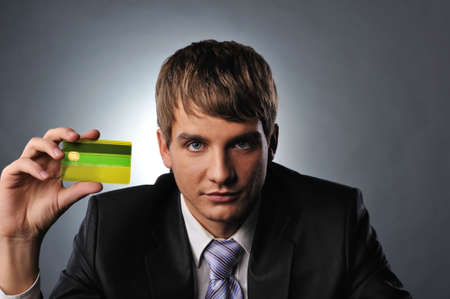 Handsome man holding credit cardの写真素材